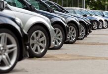UNBELIEVABLE — Dealership Loaner Car SCAM A row of parked black and silver cars in a dealership