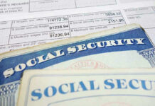 Social security cards on top of tax documents