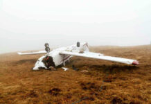Private Pilot’s Last Words Before Fatal Crash Overturned crashed airplane on grassy field.