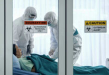 Disturbing OUTBREAK Locks Down 250 Families Healthcare workers in protective gear in quarantine room.