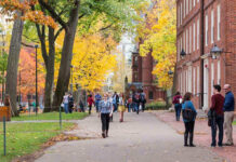 HORRIFYING University Attack Plan — FBI Stunned People walking on a college campus in autumn.