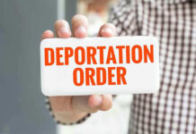Harvard Professor’s Poor Judgment Sparks DEPORTATION Hand holding sign with Deportation Order text.