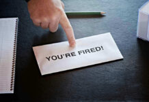 Envelope with YOURE FIRED! and pointing finger.