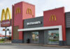 Massive McDonald’s COLLAPSE – Locations Shuttering Fast McDonalds restaurant exterior with logo and drive-thru sign.