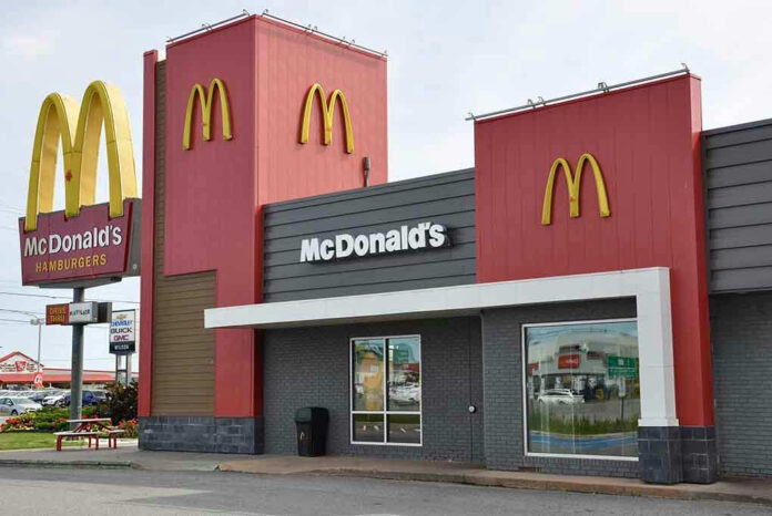 McDonalds restaurant exterior with logo and drive-thru sign.