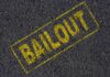 Yellow BAILOUT text marked on a black asphalt surface