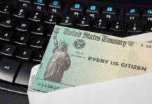 A US Treasury check placed on a black keyboard