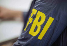 FBI RAIDS Georgia Elections Hub — 700 Boxes SEIZED! FBI jacket with yellow lettering.