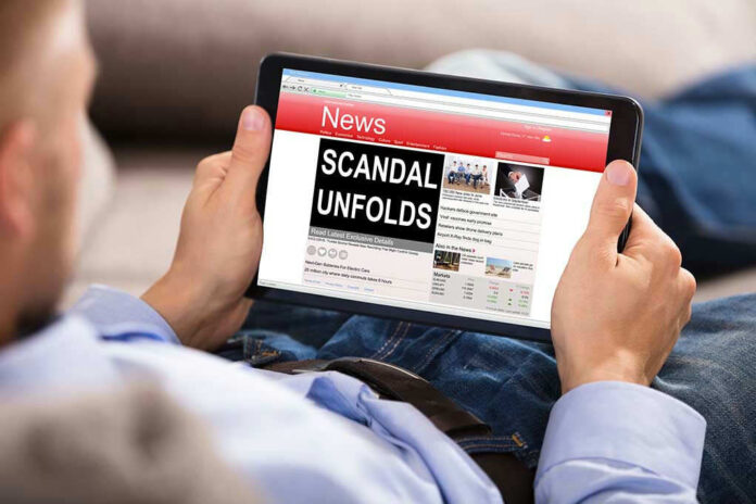 Person reading tablet with headline Scandal Unfolds.
