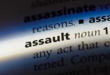 HORRIFYING Breach — Congressman Violently Attacked Close-up of a dictionary page showing the definition of the word 'assault'