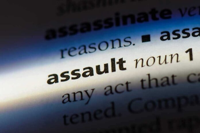 shutterstock_1065960755 (1).jpg Close-up of a dictionary page showing the definition of the word 'assault'