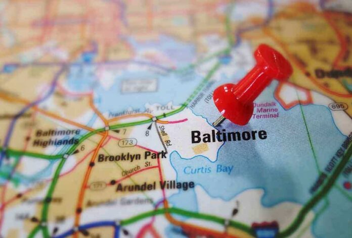 A red pushpin marking the location of Baltimore on a map