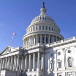MIDNIGHT Shutdown Hits Despite Senate Deal The U.S. Capitol building with a clear blue sky in the background