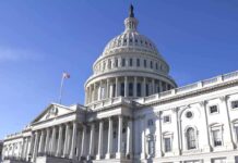The U.S. Capitol building with a clear blue sky in the background