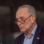 Tapper Ambush: Schumer Stunned Live A man with glasses speaking passionately during a public address
