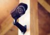 Amazon CAVES—Surveillance Nightmare Canceled A security camera mounted on a wooden wall
