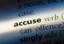 Icon Leader ACCUSED—Democrats Scramble Close-up dictionary definition of accuse underlined.