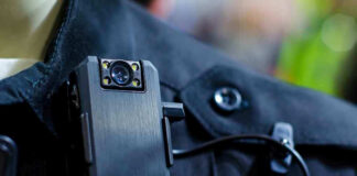 Body camera attached to a black uniform.