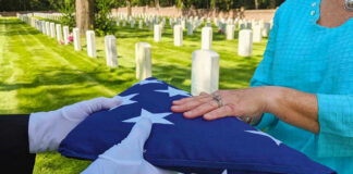 Flag folded and handed over at gravesite ceremony.