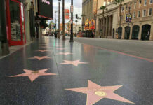 Hollywood Walk of Fame stars on sidewalk.