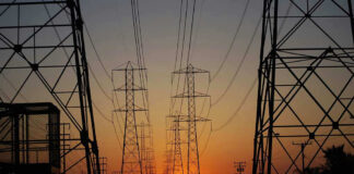 Transmission towers at sunset.