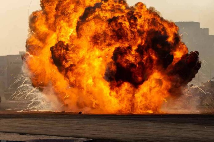 A large explosion creating a massive fireball and smoke