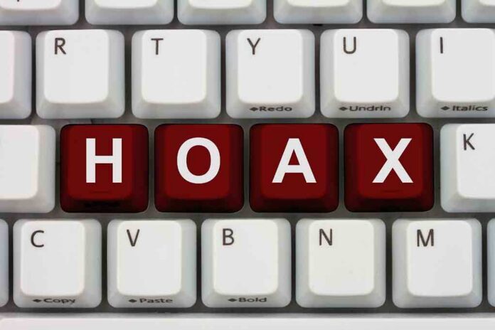 Close-up of a computer keyboard with the word HOAX spelled out in red keys