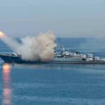 A military ship launching a missile into the ocean