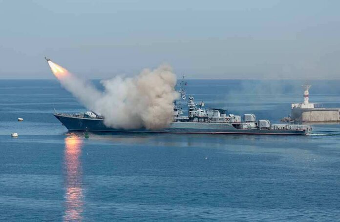 A military ship launching a missile into the ocean