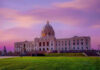 Supreme Court’s Voting Shift Sparks Redraw Chaos Historic building with dome under a pinkish-purple sky.