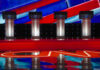 Four debate podiums on a CNN stage background.