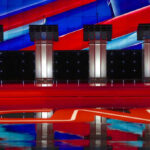 Fox’s Gutfeld ACCUSES CNN: Poll ‘Scam’ Uncovered! Four debate podiums on a CNN stage background.