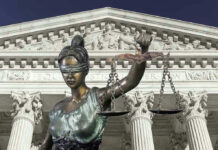 Judge Caught in Chambers Sex Scandal! Lady Justice statue in front of courthouse.