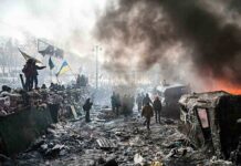 Ukraine Kidnapping Allegations: Truth or Fabrication? A chaotic protest scene with smoke, fire, and people holding flags
