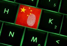 Close-up of a keyboard key featuring the Chinese flag and a fingerprint