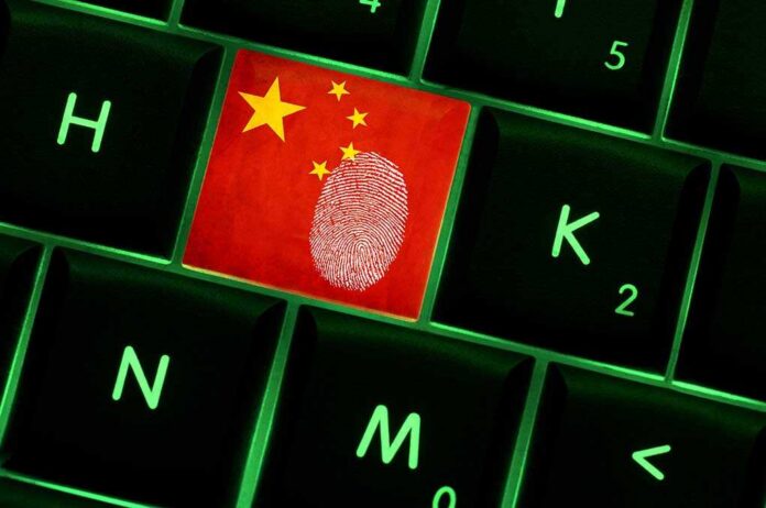 shutterstock_240941041.jpg Close-up of a keyboard key featuring the Chinese flag and a fingerprint