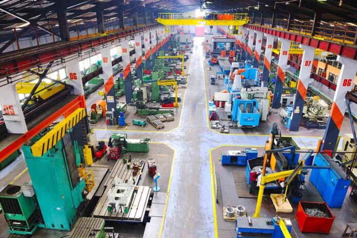 Aerial view of a large industrial workshop filled with various machinery and equipment