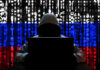 Hacker in hoodie with Russian flag background and code.
