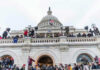 Crowd gathered on steps of Capitol building.