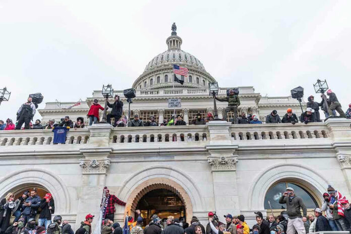 Crowd gathered on steps of Capitol building.