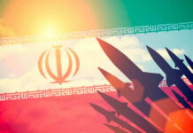 Ceasefire Shattered: Missiles Light Up Israel Silhouettes of missiles over Irans flag graphic.