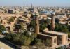 Aerial view of a city featuring traditional buildings and minarets
