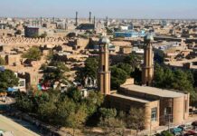 How Pakistan Hit 96% Muslim Aerial view of a city featuring traditional buildings and minarets