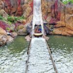 Group of people on a water ride approaching a splashdown