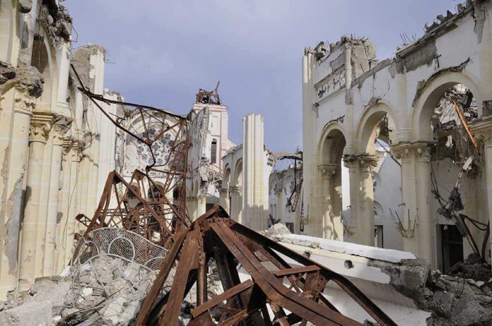 Port-au-prince,-,August,22:,A,Collapsed,Church,In,Port-au-prince,,Haiti Interior view of a destroyed building with collapsed arches and debris