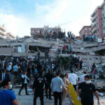 Pentagon Data Disaster Hits School People at a collapsed building after an earthquake.
