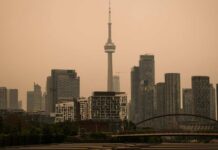 Health Risk SPIKES — City Turns Orange LIVE: View of downtown Toronto as wildfire smoke blankets city