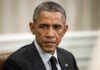Obama Clip Sparks Election Fury man in a dark suit looking to the side