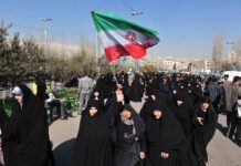 Funeral Fury: ‘Kill Trump’ Chants Erupt Group of women in black attire marching with an Iranian flag