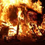 Holiday Fun Turns Deadly A large fire engulfing debris at night